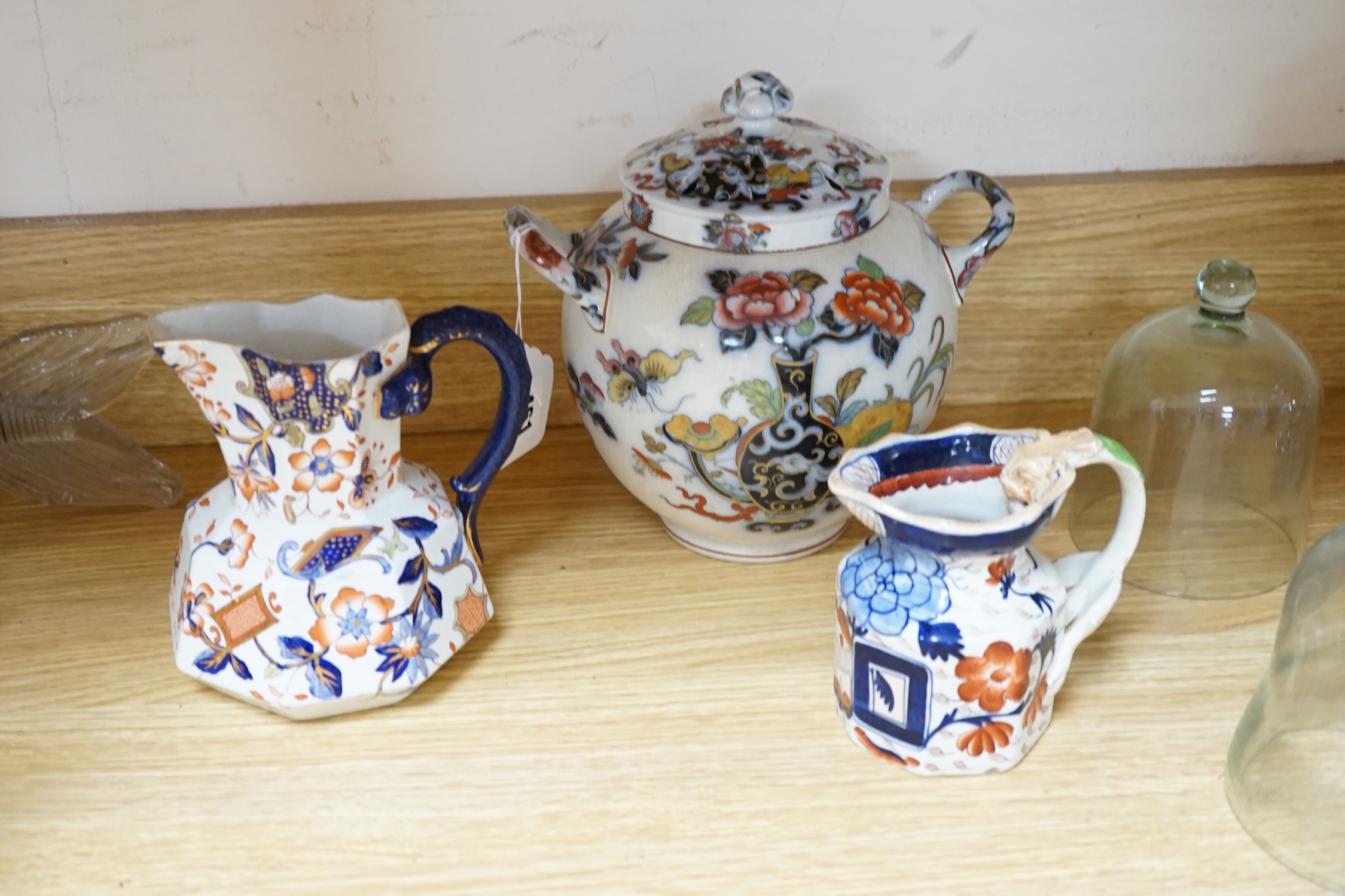 Seven ironstone items, comprising five jugs, a hexagonal dish and a lidded jar, largest 29cm wide. Condition - poor to fair